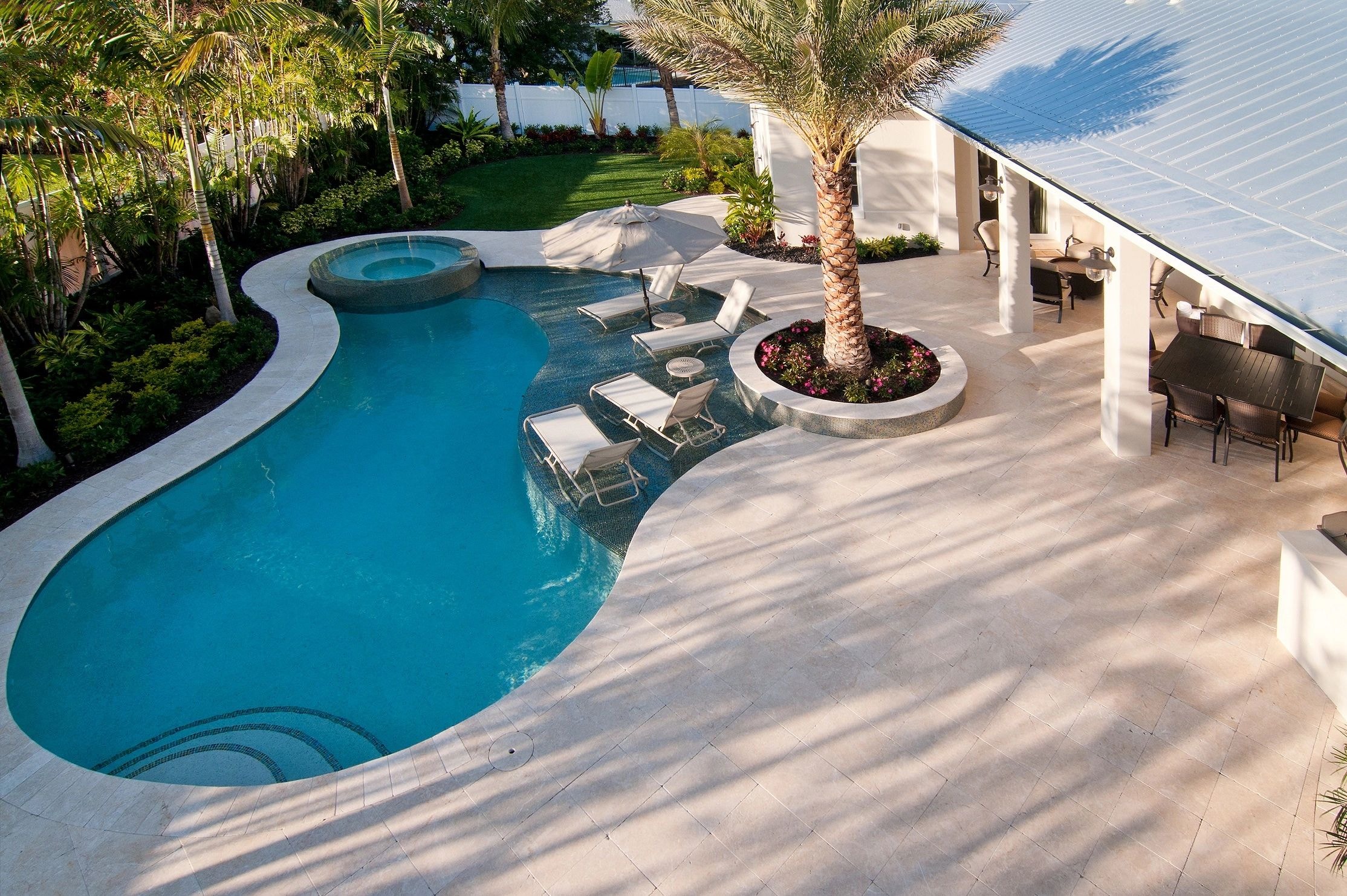 Aerial view of luxury waterfront pool designed by MJPLA